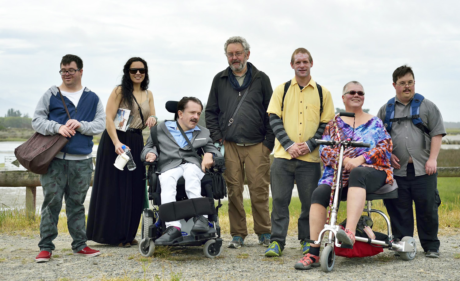 group of actors deemed to have cognitive differences on an inlet beach in Aotearoa